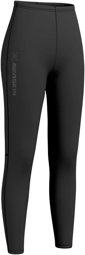 Woman wearing Seaskin black wetsuit pants while kayaking